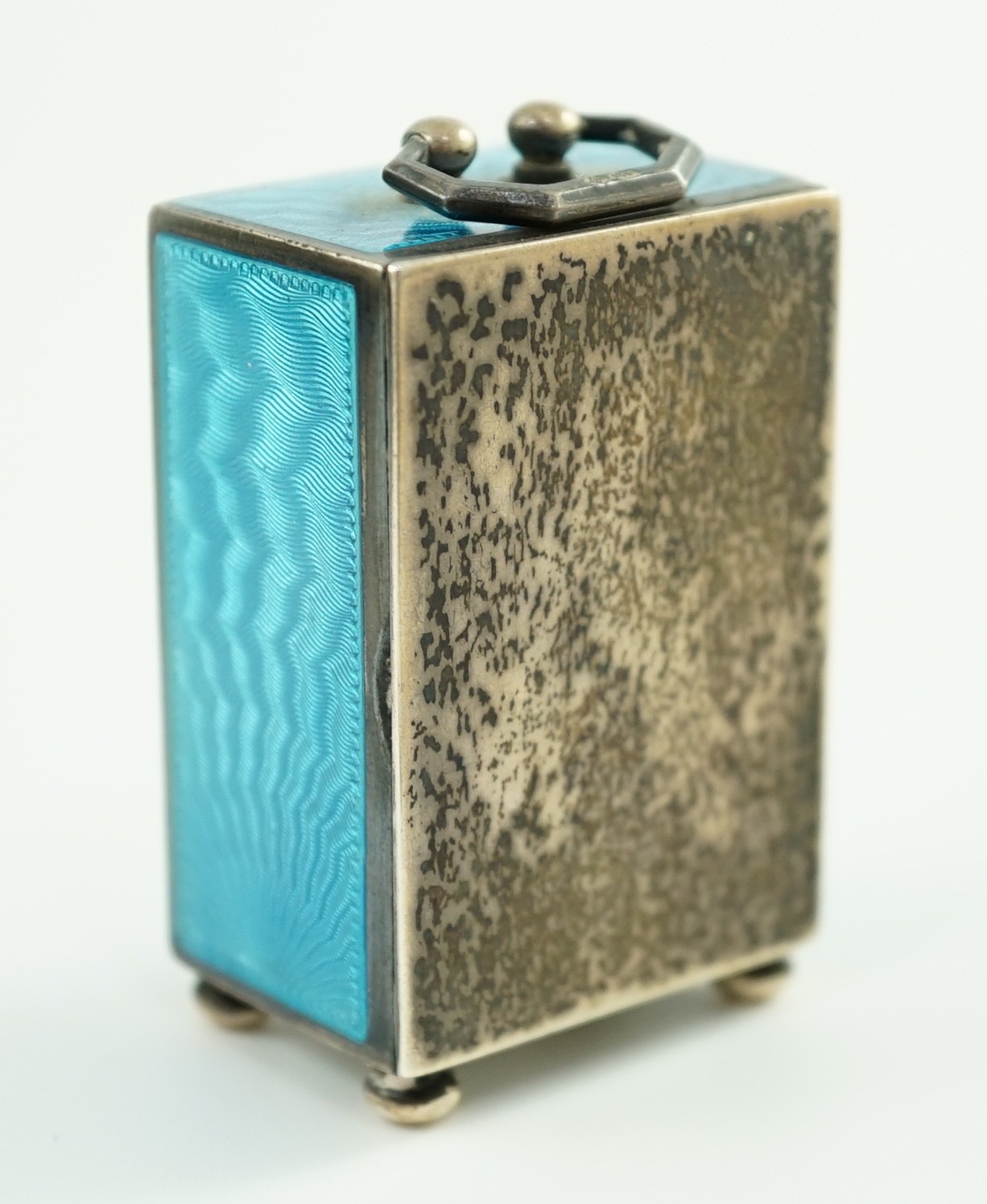 A George V Swiss blue enamel and silver cased miniature carriage timepiece, import marks for Arthur George Rendell, London, 1924, 43mm, on bun feet, in gilt tooled leather carrying case